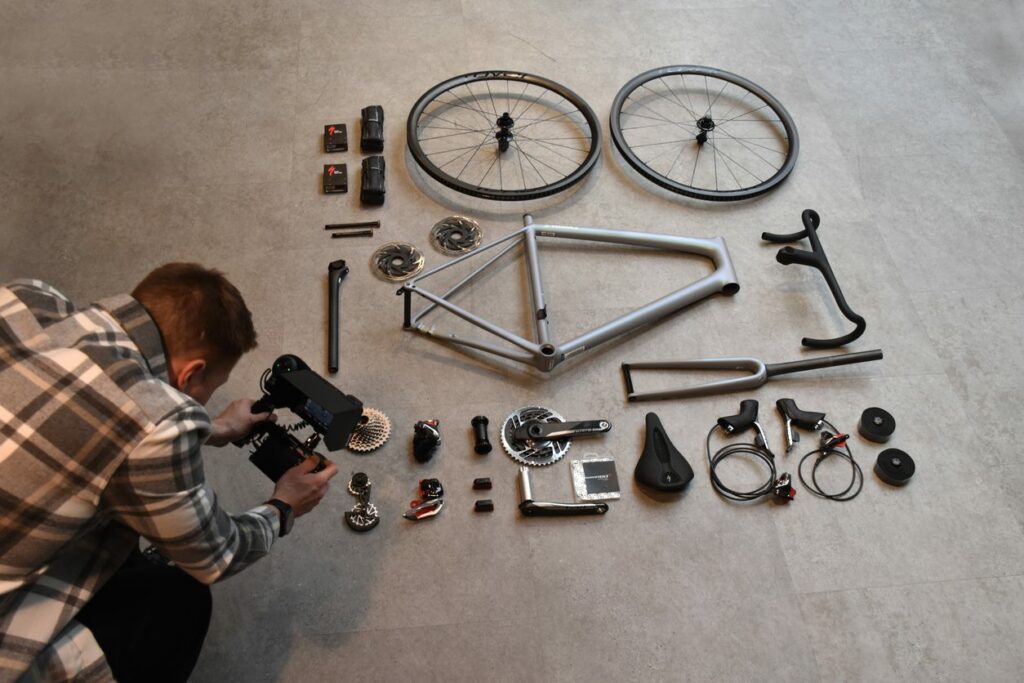 James-photographing-his aethos-bike-parts